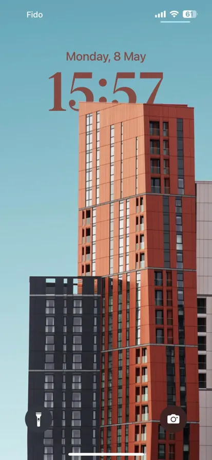 A high-rise building with an orange and black exterior
