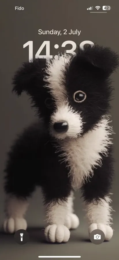 A tiny cute 3D felt border collie made from felt fibers.