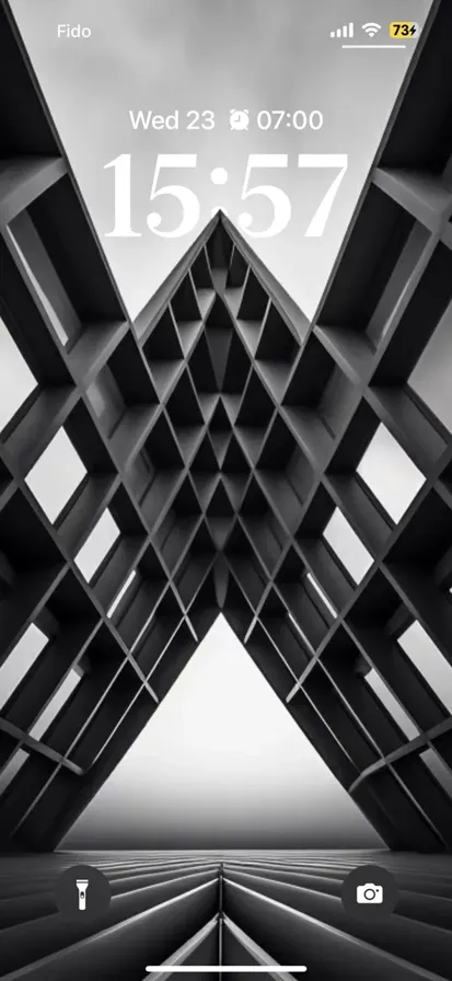 A visually striking black and white triangle pattern with high contrast, creating a dramatic and depth-filled background.