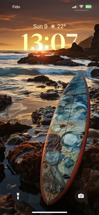 A colorful surfboard on high waves crashing against rocks