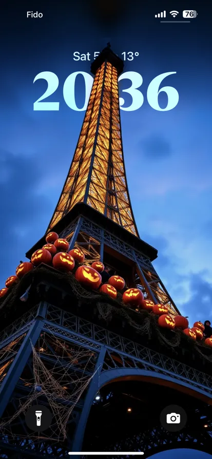 Eiffel Tower lit up with carved pumpkins for Halloween.