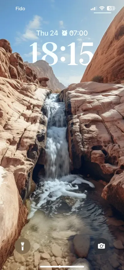 Magical oasis: vibrant waterfall in a desert paradise, embraced by mighty mountains, showcasing nature's tranquility.