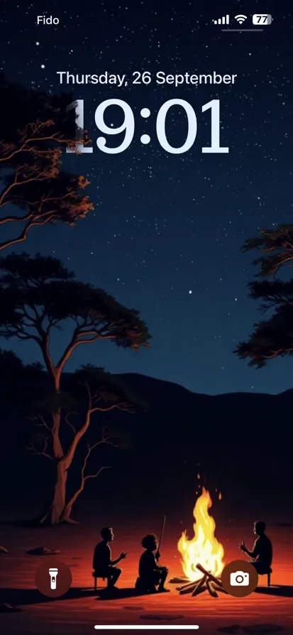 A serene night scene of people around a campfire.