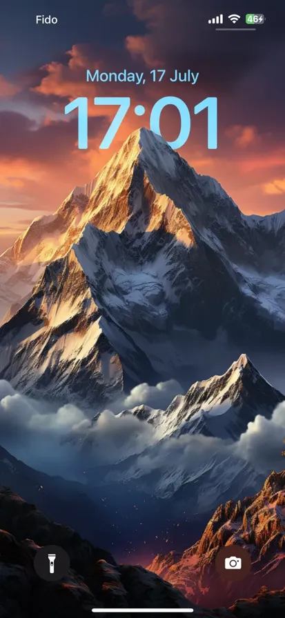 Magnificent sunlit snow-capped mountain, towering with breathtaking beauty, set against a vivid blue sky.
