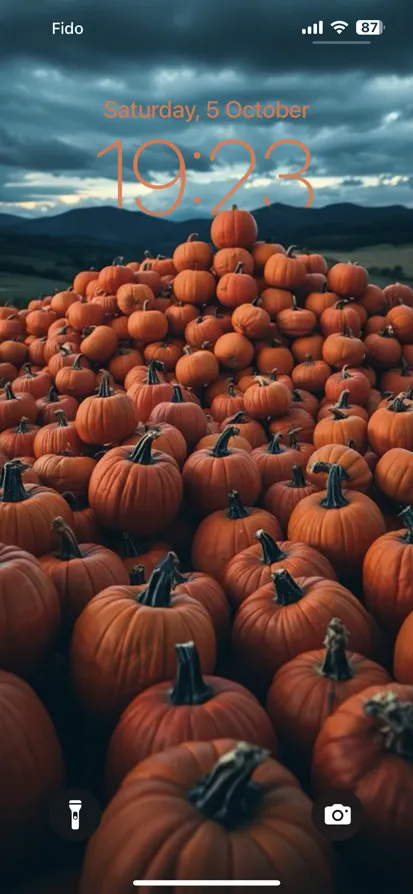 A pyramid of vibrant orange pumpkins against a moody sky. - depth effect wallpaper