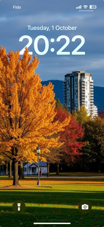 A serene park in autumn with vibrant trees and modern buildings in the background.